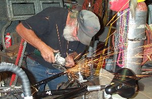 Bill Soux welds the bike